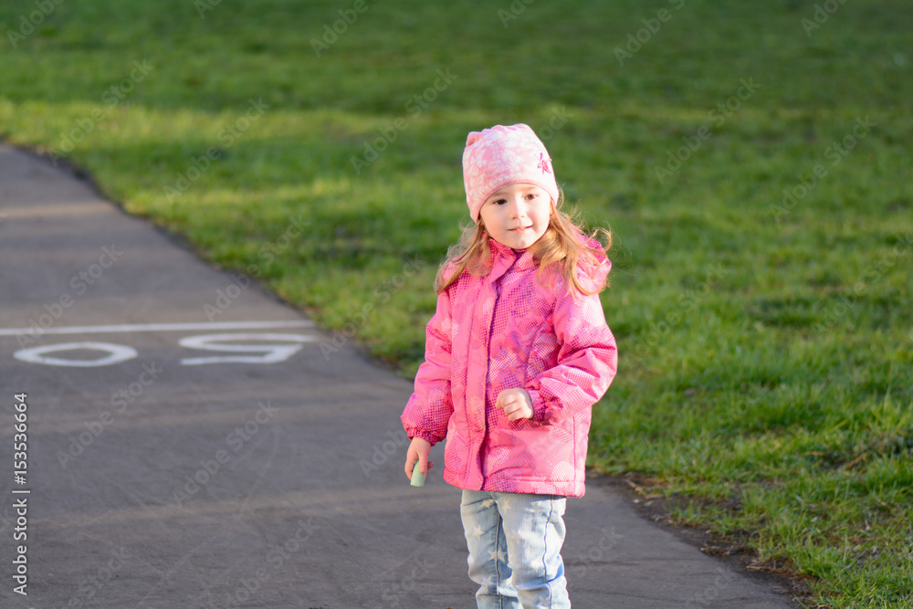Little girl walks on the street Little girl walks on the street