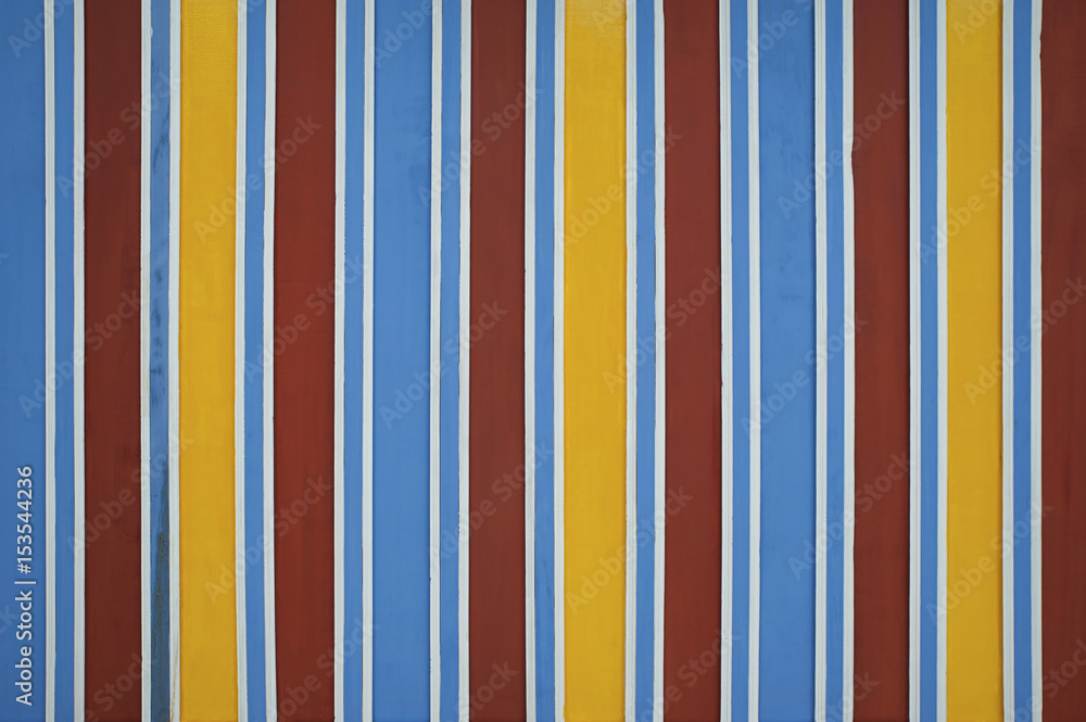 Brightly colored ceiling in traditional tones spotted in Marrakesh, Morocco. Vibrant color stripes background, in traditional Moroccan architecture. Brightly colored ceiling in traditional tones spotted in Marrakesh, Morocco. Vibrant color stripes background, in traditional Moroccan architecture.