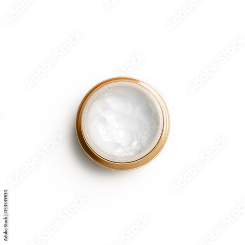 Container of moisturizing face cream on white background. Top view, flat lay. Fashion woman still life. Pop female things, medicine and cosmetic theme.