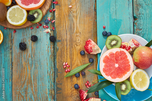 Wallpaper Mural Colorful fruit on wood background Torontodigital.ca