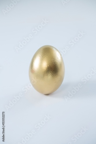 Golden Easter egg on white background
