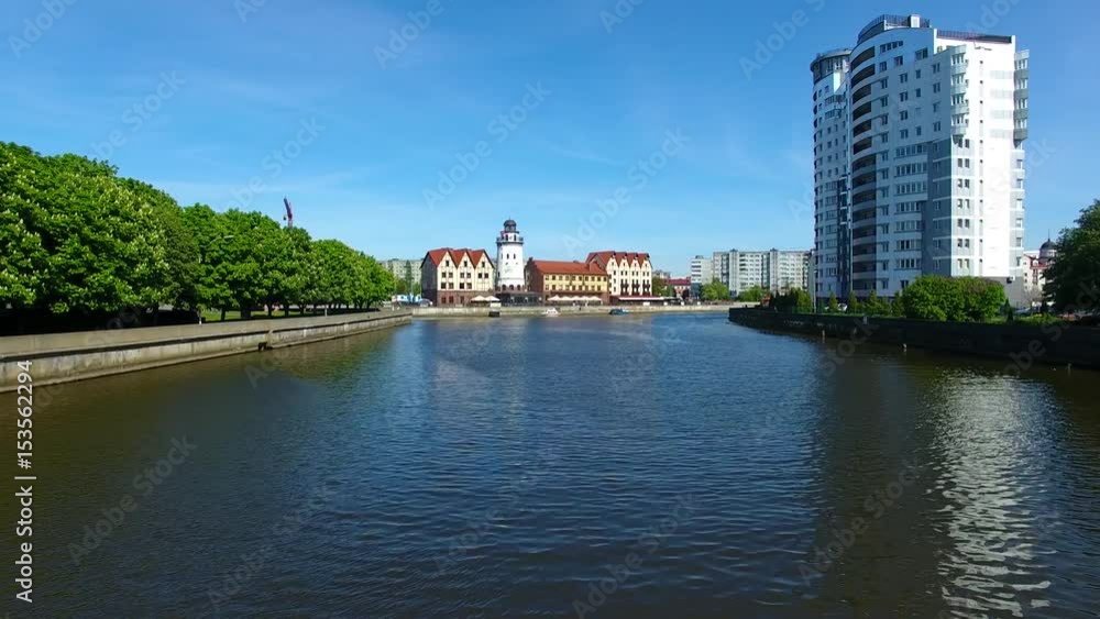 Flight over the river against the background of the Fishing Village, Kaliningrad Flight over the river against the background of the Fishing Village, Kaliningrad