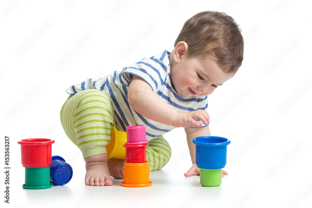 baby is playing with educational toys over white background baby is playing with educational toys over white background