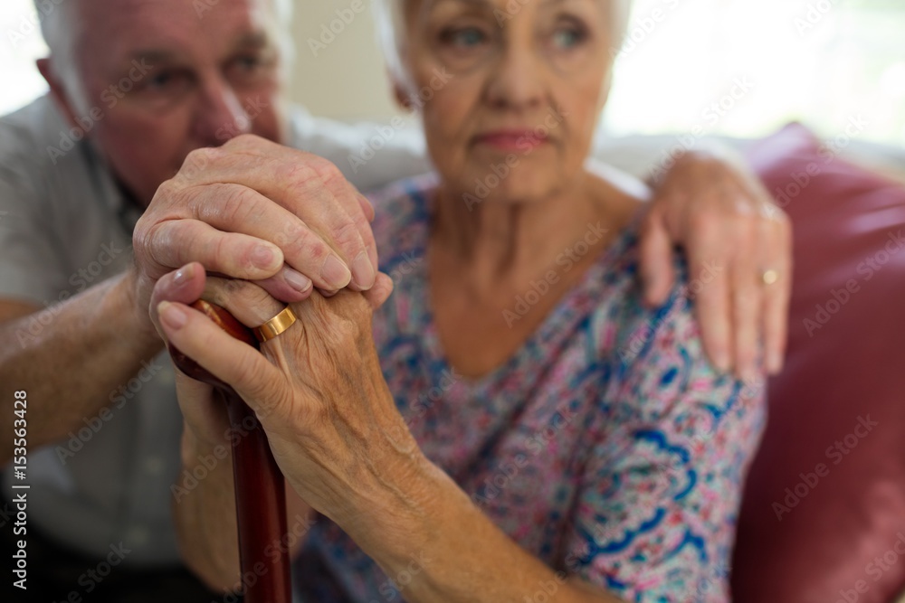 Fototapeta premium Senior man holding hands of old woman