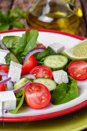 salad with spinach, cheese and tomato