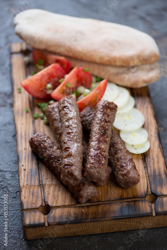 Close-up of bbq balkan cevapi or skinless beef sausages, selective focus, shallow depth of field