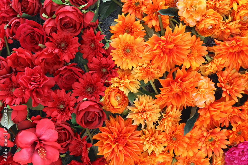 close up on red and orange flowers background close up on red and orange flowers background