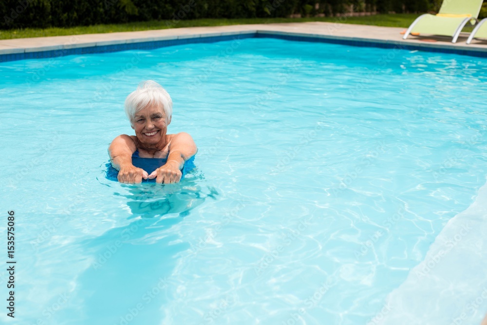 Senior woman swimming in the pool