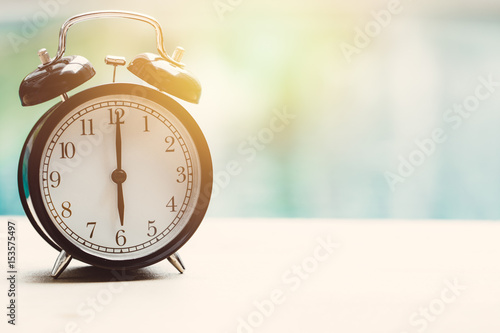 6 o'clock retro clock at the swimming pool outdoor relax time holiday time concept.