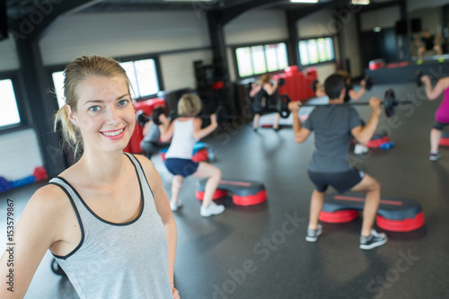 Canvastavla portrait of pretty female in modern fitness room