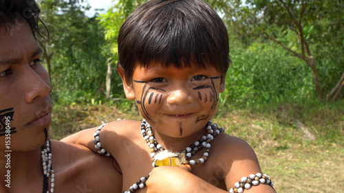 Father and Son at an indigenous tribe in the Amazon photo