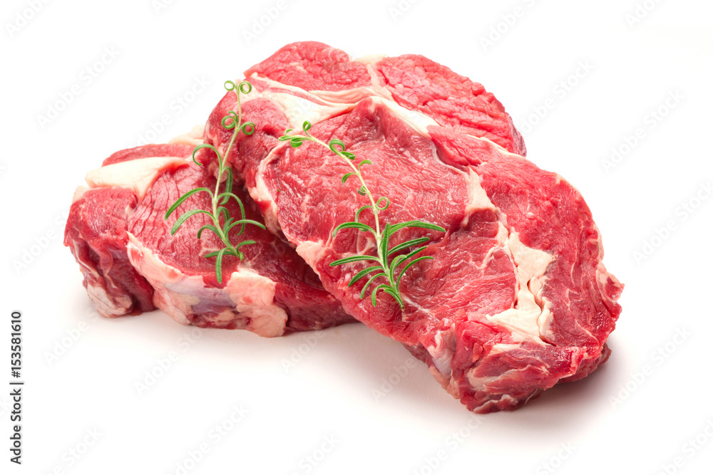 Obraz premium Raw steaks isolated on white background