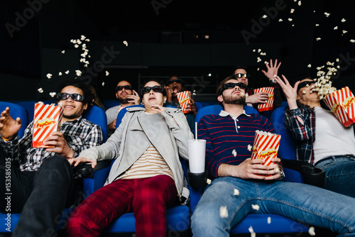 Young people scared by a 3D movie at the cinema
