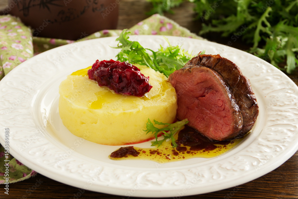 Roast veal with mashed potatoes and plum chutney. Roast veal with mashed potatoes and plum chutney.