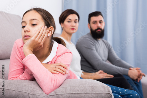 Parents lecturing daughter