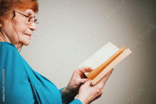 Old woman reading a book
