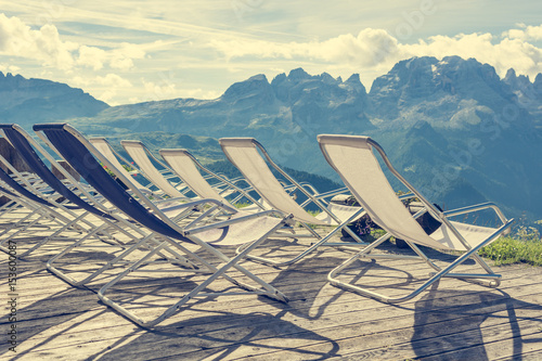 Mountain resort terase with empty chairs. photo