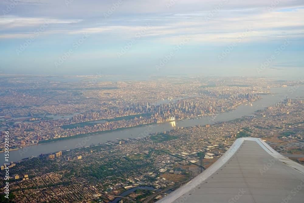 Aerial view of the Manhattan skyline in New York City seen from an airplane window 