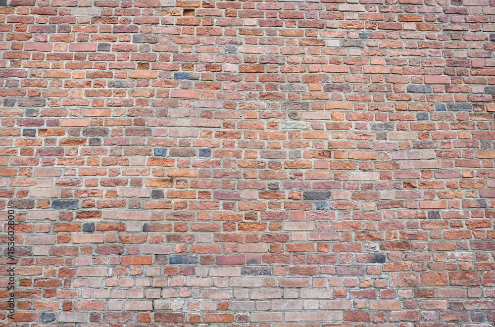Fototapeta premium Red bricks wall background. Wall of old building useful as backdrop.