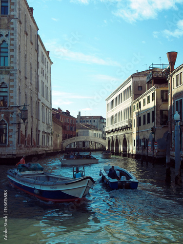 Canal in venice with bridge and boats