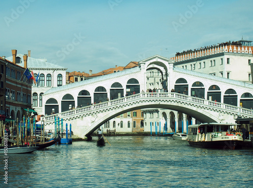 The rialto bridge in venice with boats and blue sky © Philip J Openshaw 