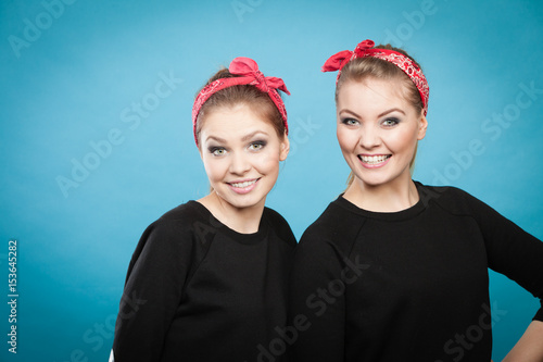 Two funny positive retro styled female portrait.