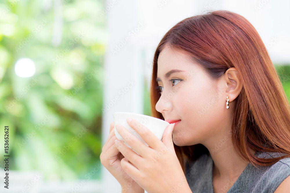 Beautiful businesswoman have enjoyed in the garden with coffee. Beautiful businesswoman have enjoyed in the garden with coffee.