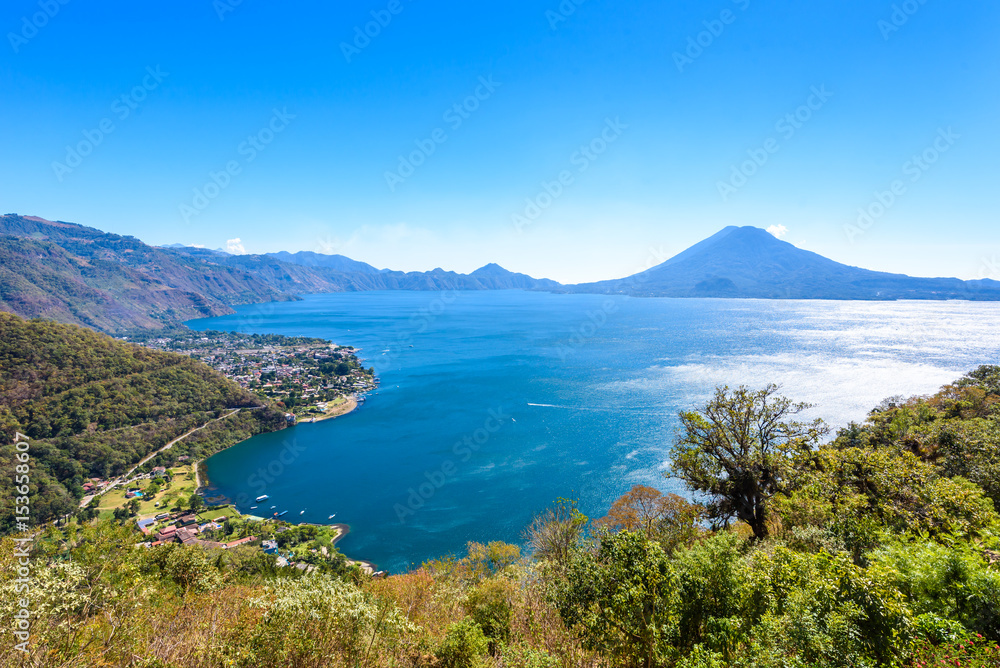Panorama view to the village Panajachel at the lake Atitlan with amazing volcanos - Guatemala