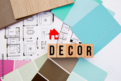 Decor in block letters with house drawings, samples and house icon
