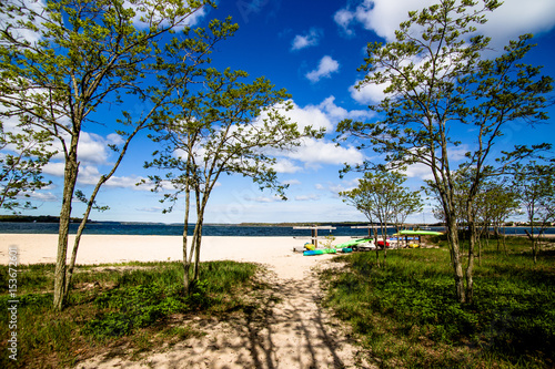 Colorful kayaks on wooden stands at the beach.Summer  outdoors  water sports and vacation concept 