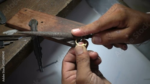 Slow motion video,Goldsmith is polishing a gold or silver ring