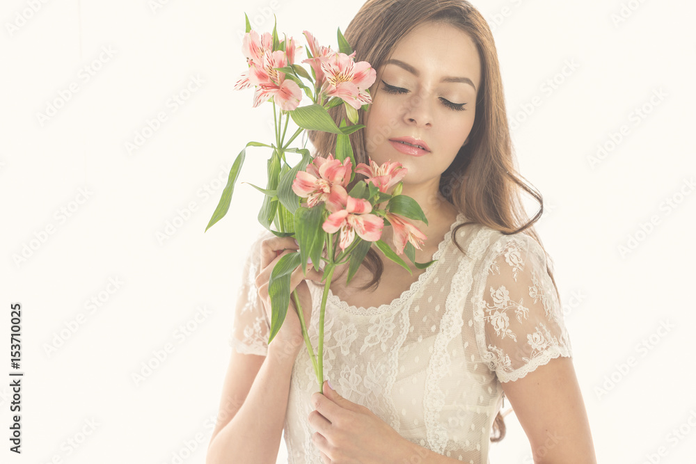 Lovely girl with a bouquet of flowers Lovely girl with a bouquet of flowers