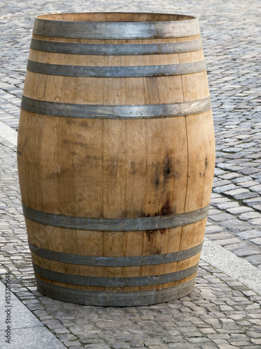 Wooden barrel on paving stones