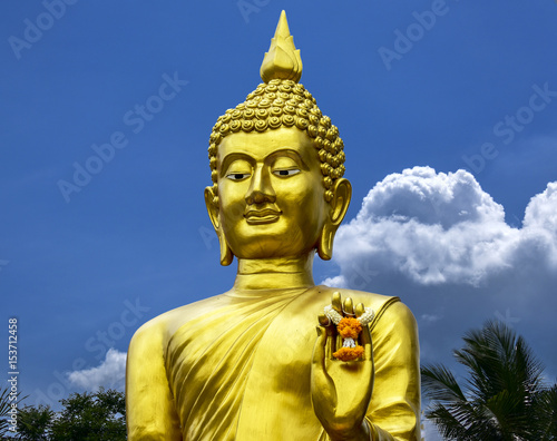 CColor Gold Buddha with White clouds blue sky background photo