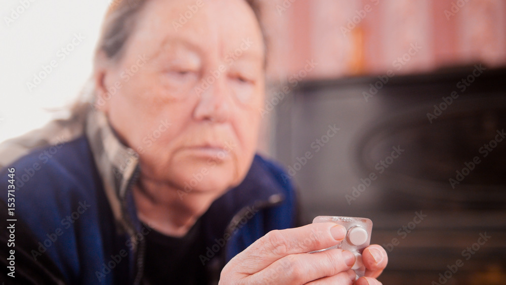Tablets in the hands of an elderly woman Tablets in the hands of an elderly woman