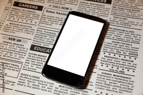 fake newspaper and smartphone