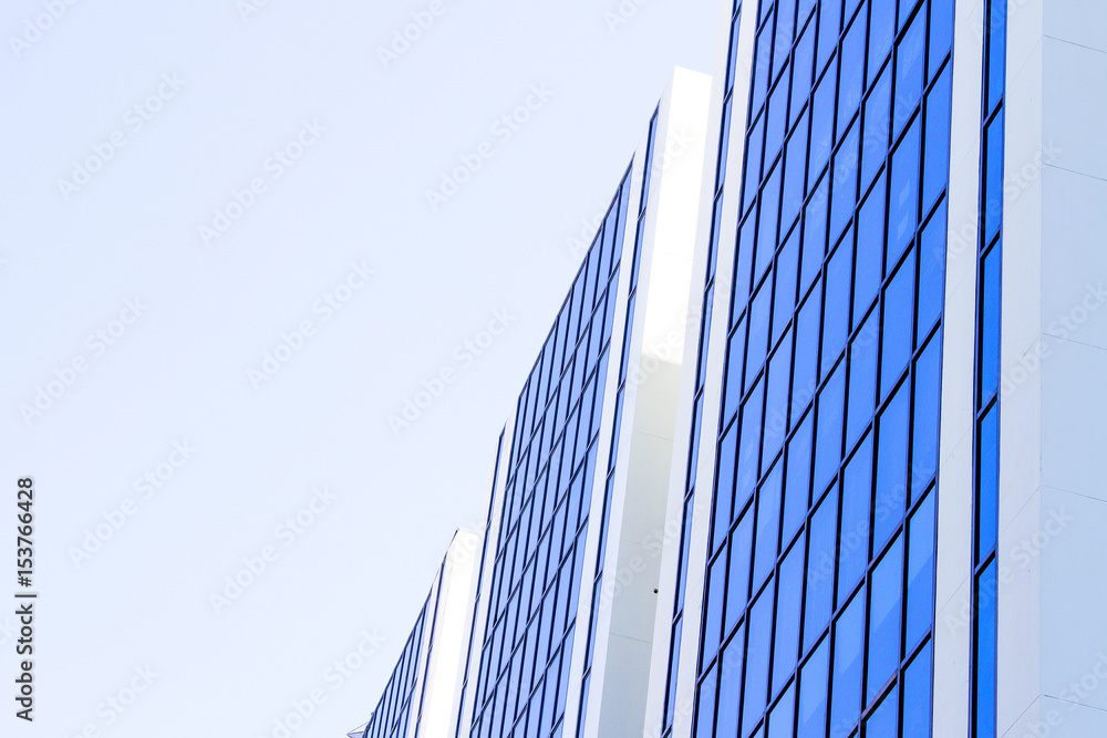 Blue sky reflected on blue building side Blue sky reflected on blue building side