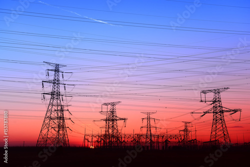 High piezoelectric towers, in the setting sun