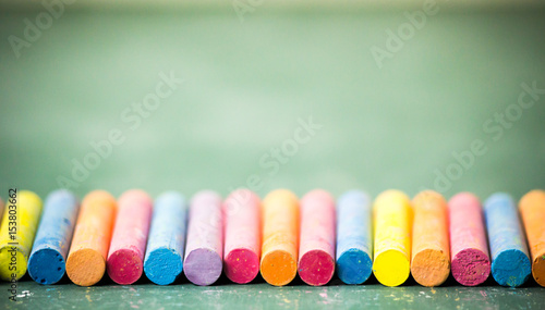 chalkboard and colorful chalks background