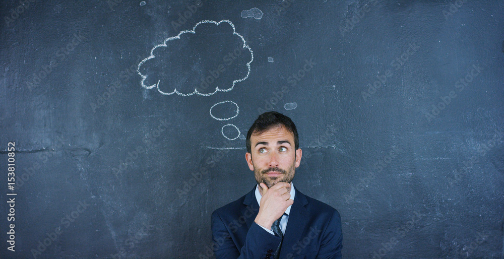 Portrait of a beautiful business man, a marketing teacher, thinking about new ideas and strategies, on a black background. Concept: career growth, growth chart, successful man, marketing, ideas. Portrait of a beautiful business man, a marketing teacher, thinking about new ideas and strategies, on a black background. Concept: career growth, growth chart, successful man, marketing, ideas.