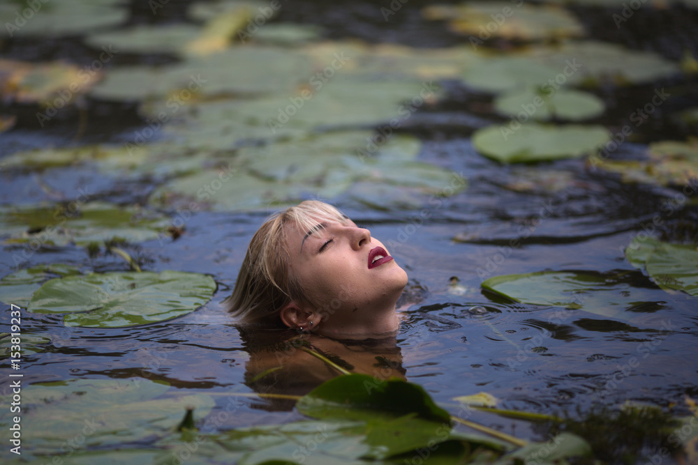 Fototapeta premium The girl in the pond