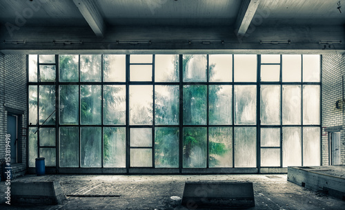 The view from an old, abandoned factory on the inside with nice window light