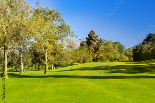 Green golf field on the sunny coast of Mediterranean sea