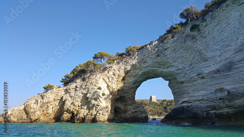San Felice arch (Architello) from boat, Gargano coast, Vieste, Italy photo
