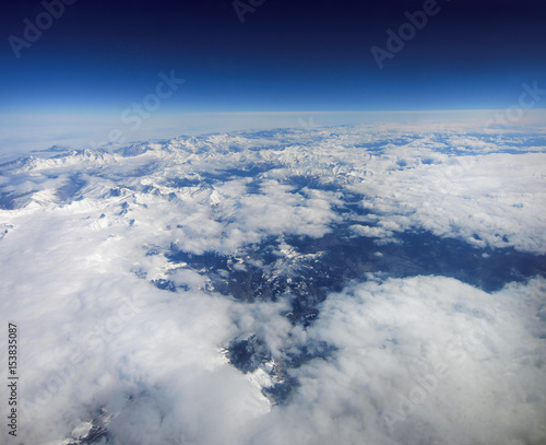 Panorama of white mountains with clouds