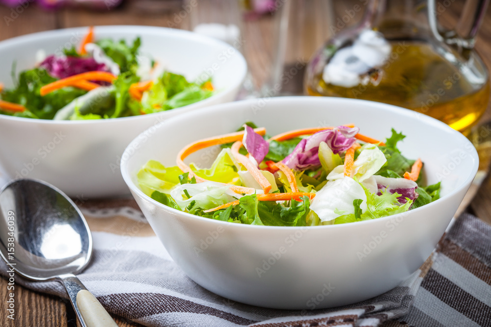 Mixed salad in white bowl. Mixed salad in white bowl.