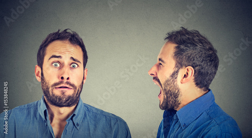Canvas Print Split personality. Angry man screaming at scared himself