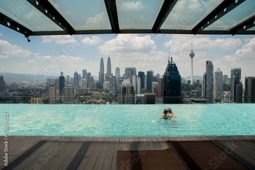 Canvas Print Swimming pool on roof top with beautiful city view Kuala lumpur, Malaysia