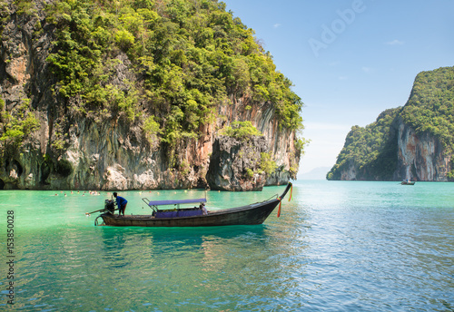 Beautiful landscape of rocks mountain and crystal clear sea with longtail boat at Phuket, Thailand. Summer, Travel, Vacation, Holiday concept. © ake1150