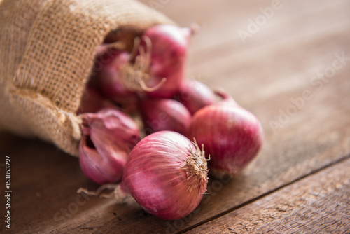 Red onion on a wooden table